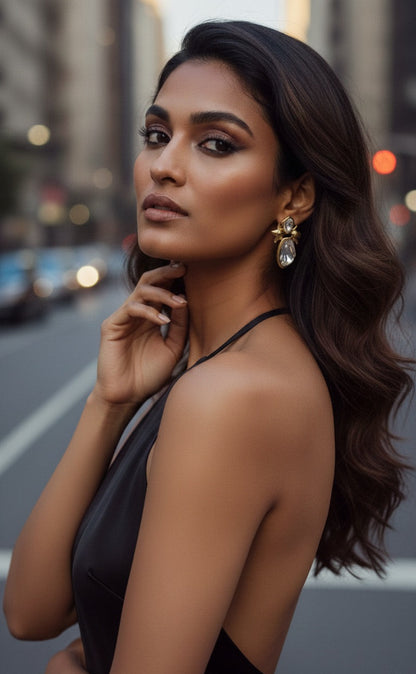 Woman in a black dress with a blurred city street background