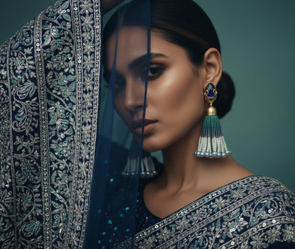 Woman wearing traditional jewelry with a dark background