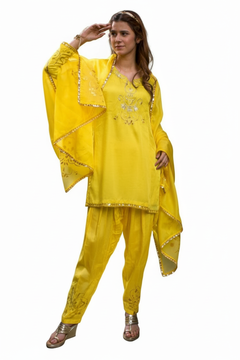 Woman wearing a yellow traditional outfit with a dupatta on a white background